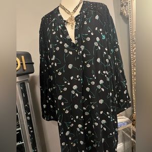 This top is black with green flowers and the shoulders made crochet patterned